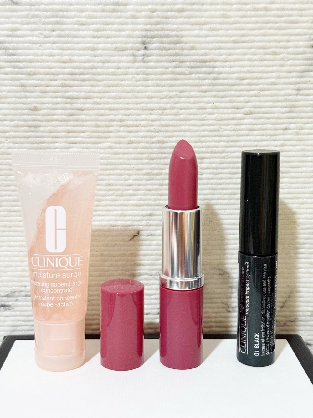 Clinique Beauty Set: Plum Pop Lipstick, Black Mascara & Moisture Surge